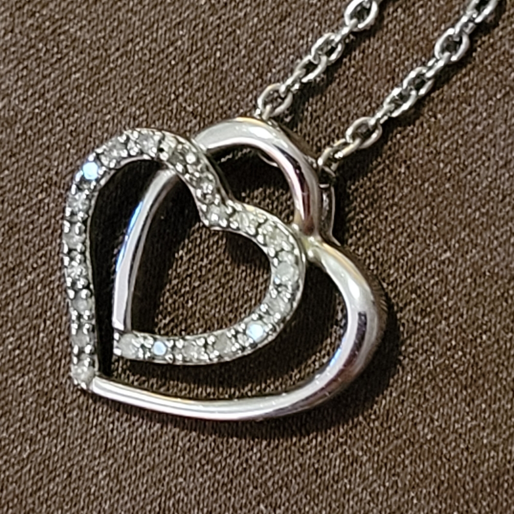 Sterling silver necklace with entwined heart pendant